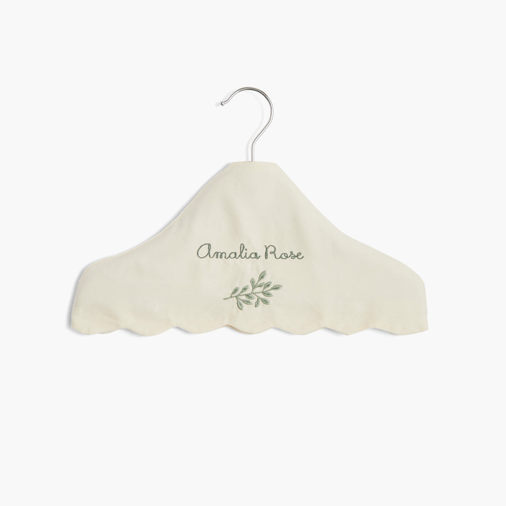 Children's Hanger in Ivory with a personalized monogram name on front.
