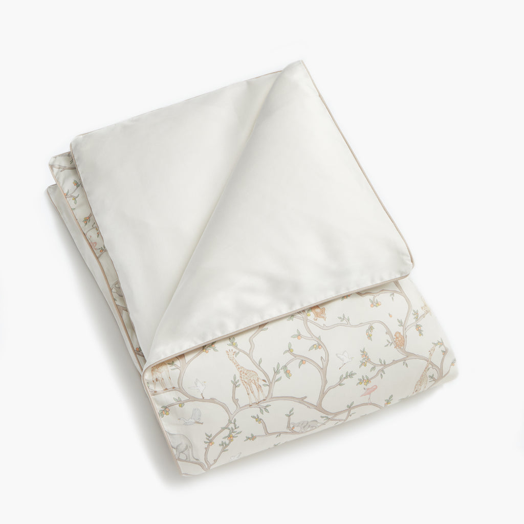 Personalize Me: Animal Parade Baby Duvet in Ivory folded to see other side