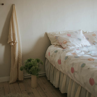 Touch The Sky Full/Queen Duvet Cover in the Pink Print displayed on bed. Shown with two standard size pillow cases in the same print.