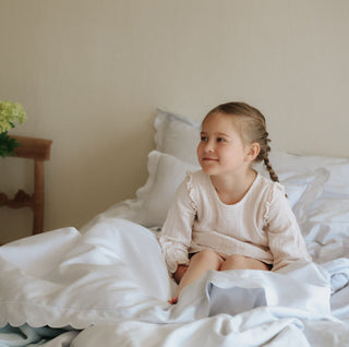 Scalloped Starlight Full Queen Duvet in Blue with child sitting in bed