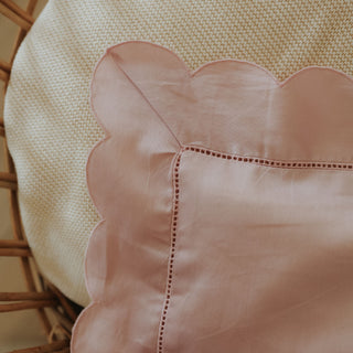 Scalloped Starlight Toddler Pillow in Rose in Crib corner shot
