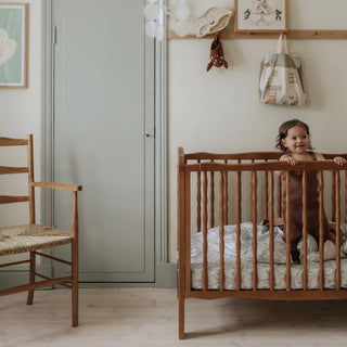 Baby jumping in a crib. 