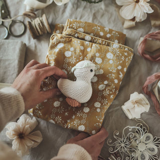 Duvet cover with gooselings on top of it. 