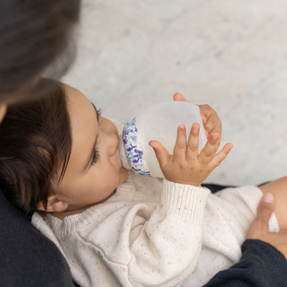 Baby feeding from a bottle