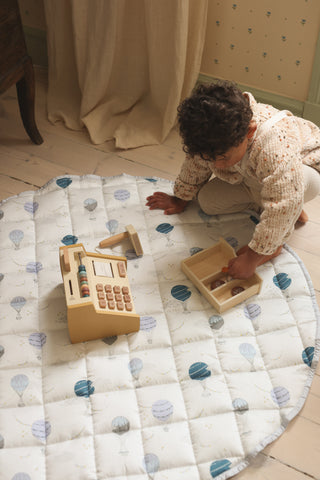 Child playiing on playmat