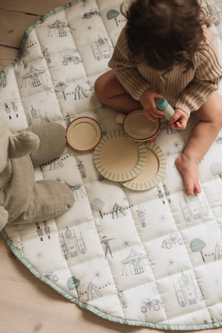 child playing on play mat