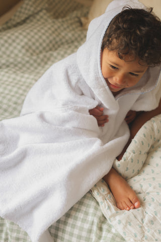 Toddler in toddler poncho