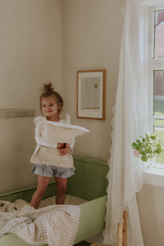 Child in Bedroom with Wall Art
