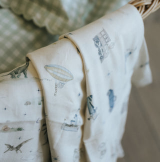 Swaddles laying on a crib