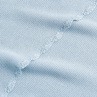 Cotton Knit Baby Blanket in Blue. Close up shot to see soft woven texture and trim detail.