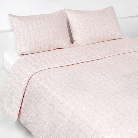 Birds Song Full/Queen Duvet Cover in the Pink Print displayed on bed. Shown with two standard size pillow cases in the same print.