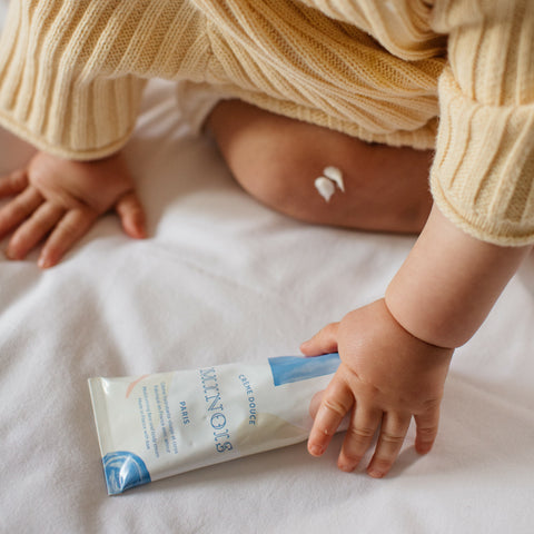 Minois Gentle Cream in childs hand.