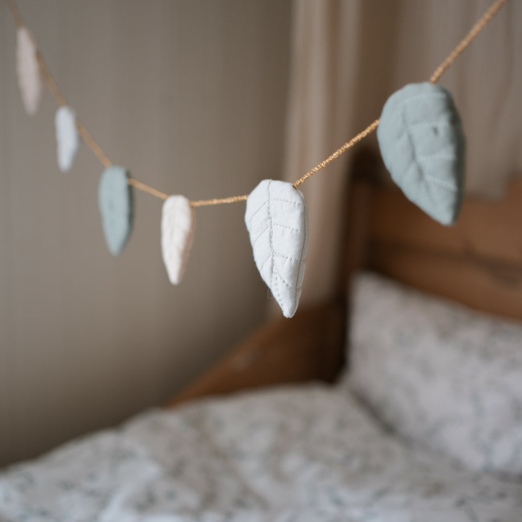 Secret Garden Garland hanging across bed 