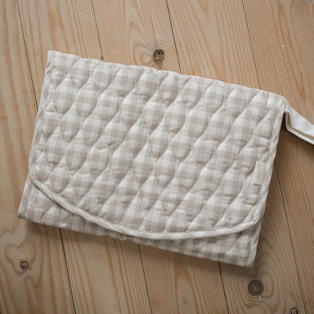 Portable Changing Mat Folded In Picnic Gingham in Beige