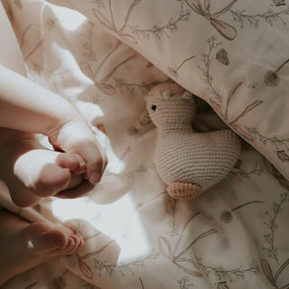 Bows & Butterfly Kisses Baby Duvet in Pink with baby and goosie stuffy