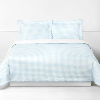 Picnic Gingham Full/Queen Duvet Cover in the Blue Print displayed on bed. Shown with two standard size pillow cases in the same print.