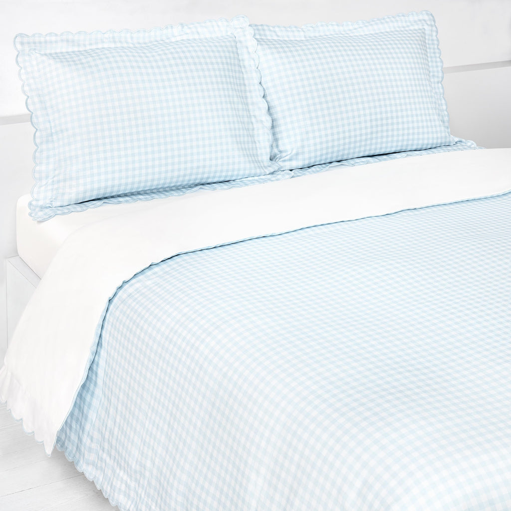 Picnic Gingham Full/Queen Duvet Cover in the Blue Print displayed on bed. Shown with two standard size pillow cases in the same print.