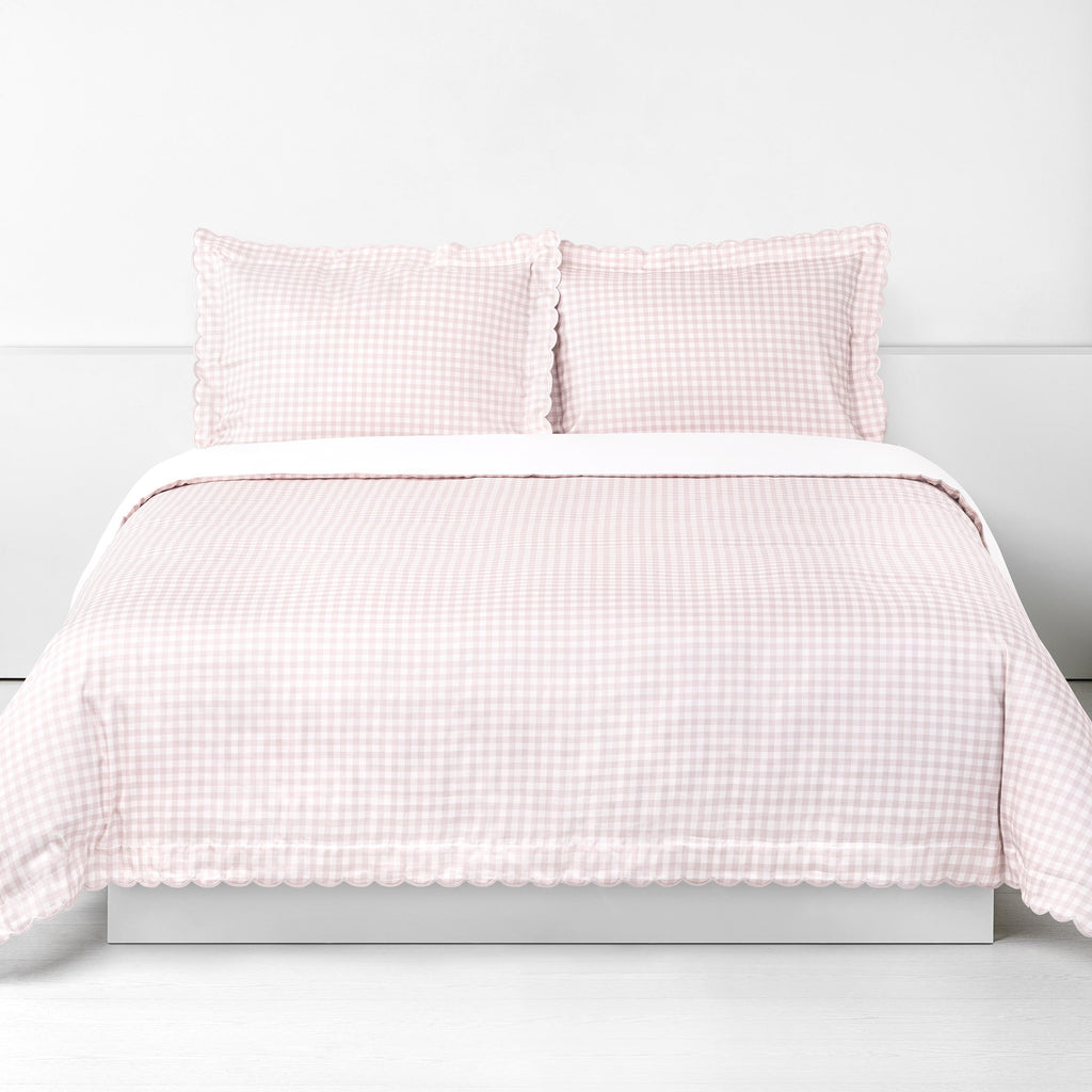 Picnic Gingham Full/Queen Duvet Cover in the Pink Print displayed on bed. Shown with two standard size pillow cases in the same print.