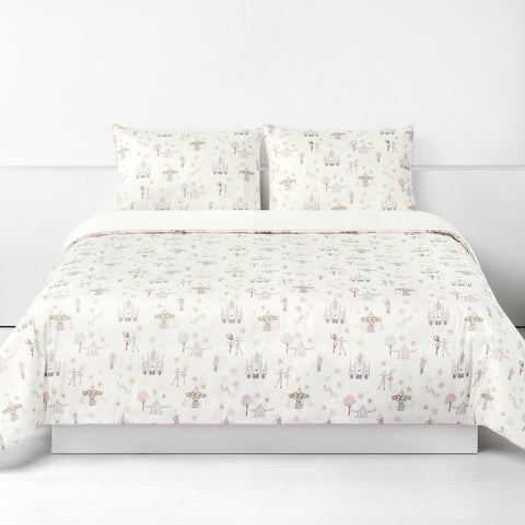 Adventures in Wonderland Full/Queen Duvet Cover in the Rose Print displayed on bed. Shown with two standard size pillow cases in the same print.