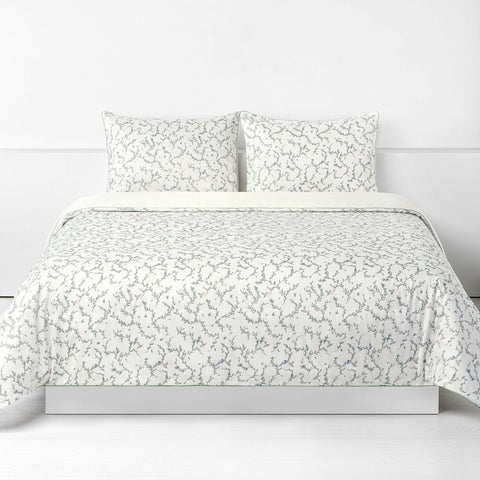 Secret Garden Full/Queen Duvet Cover in the Ivory Print displayed on bed. Shown with two standard size pillow cases in the same print.