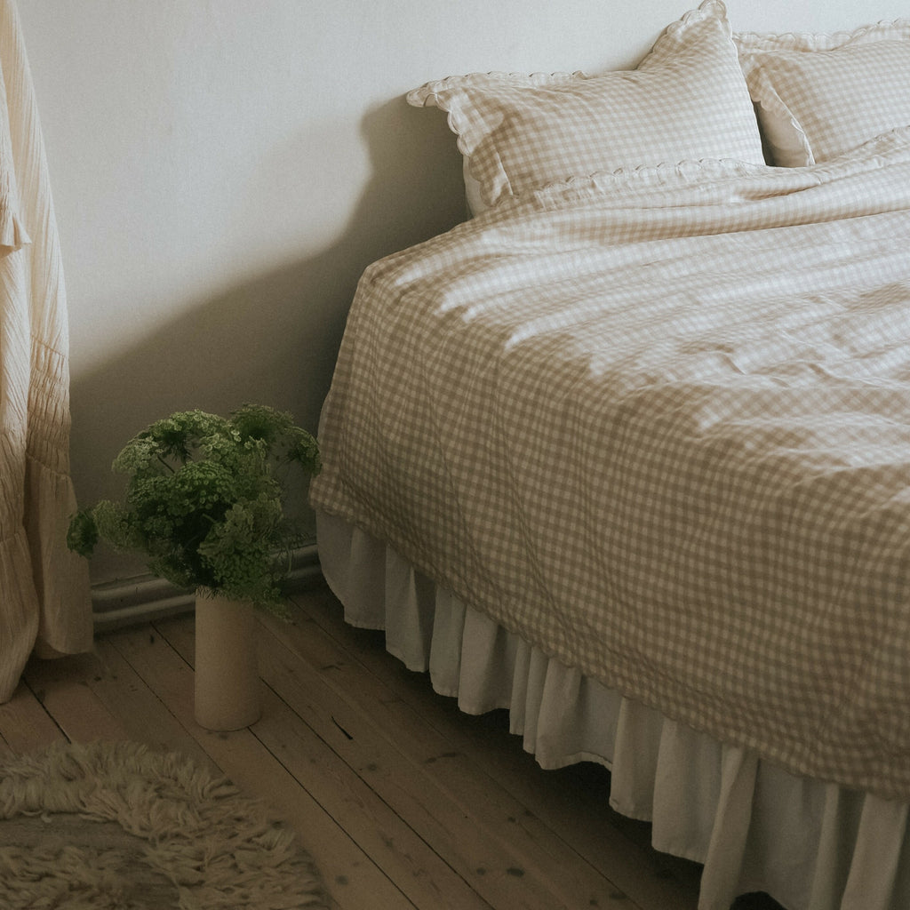 Picnic Gingham Full/Queen Duvet Cover in the Beige Print displayed on bed. Shown with two standard size pillow cases in the same print.