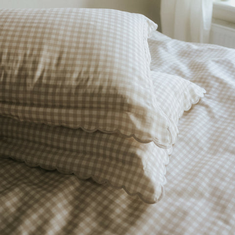 Picnic Gingham Full/Queen Duvet Cover in the Beige Print displayed on bed. Shown with two standard size pillow cases in the same print.