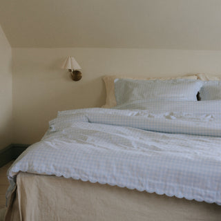 Picnic Gingham Full/Queen Duvet Cover in the Blue Print displayed on bed. Shown with two standard size pillow cases in the same print.