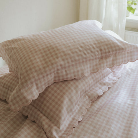 Picnic Gingham Full/Queen Duvet Cover in the Pink Print displayed on bed. Shown with two standard size pillow cases in the same print.