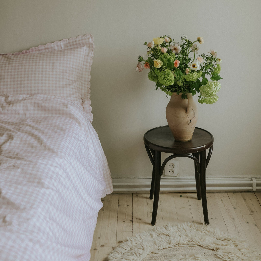 Picnic Gingham Full/Queen Duvet Cover in the Pink Print displayed on bed. Shown with two standard size pillow cases in the same print.