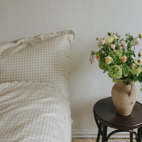 Picnic Gingham Full/Queen Duvet Cover in the Beige Print displayed on bed. Shown with two standard size pillow cases in the same print.