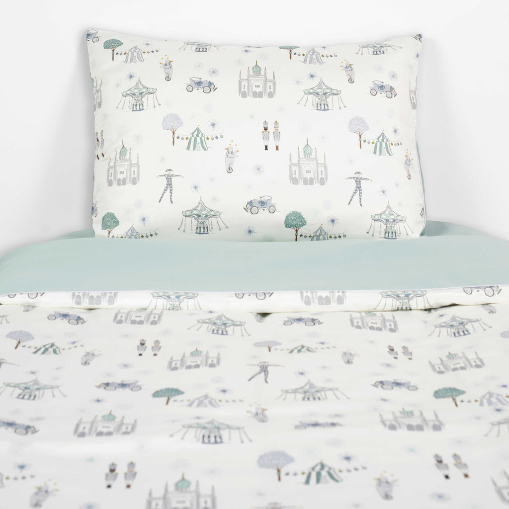 Adventure In Wonderland In Aqua on a Twin Bed with a Pillow