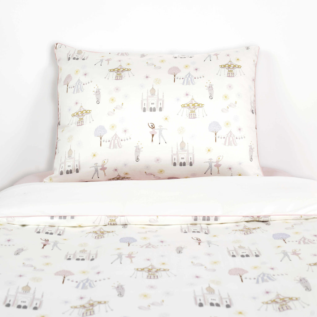 Adventure In wonderland Print in Pink on a Twin Bed with a Pillowcase