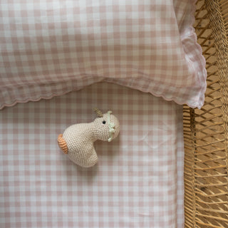 Knit Gooseling in Cotton Side Angle in Crib Bed with Pink GIngham
