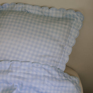 Picnic Gingham Full/Queen Duvet Cover in the Blue Print displayed on bed. Shown with two standard size pillow cases in the same print.
