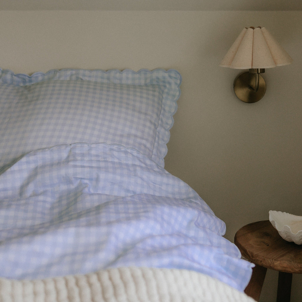 Picnic Gingham Full/Queen Duvet Cover in the Blue Print displayed on bed. Shown with two standard size pillow cases in the same print.