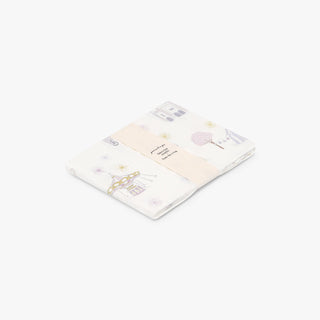 Adventures in Wonderland Swaddle Blanket in Rose.