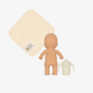 Set of baby items including a toy, bath sponge, and sippy cup on a white background