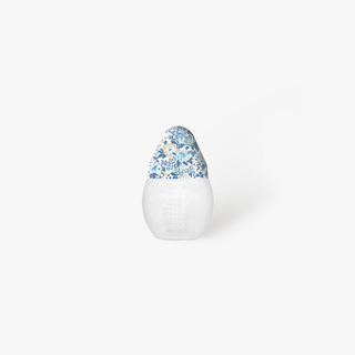 Baby bottle with a blue floral pattern top on a white background