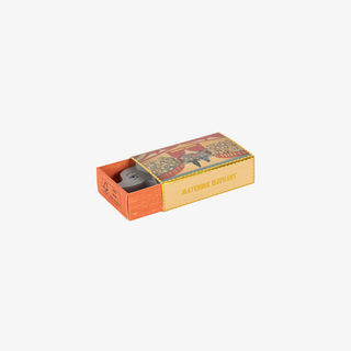 Matchbox with a colorful label on a white background