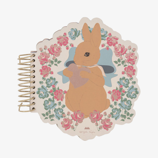Spiral bound notebook with bunny and floral motifs on the cover. 