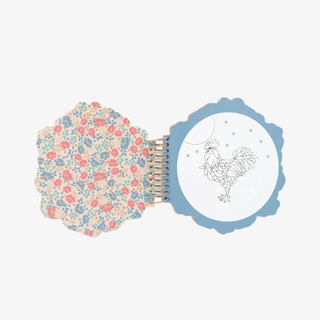 Floral-patterned notebook with a rooster illustration on a light blue background