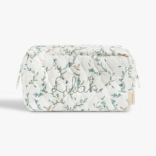Quilted pouch with floral patterns and 'Lilah' embroidery on a white background
