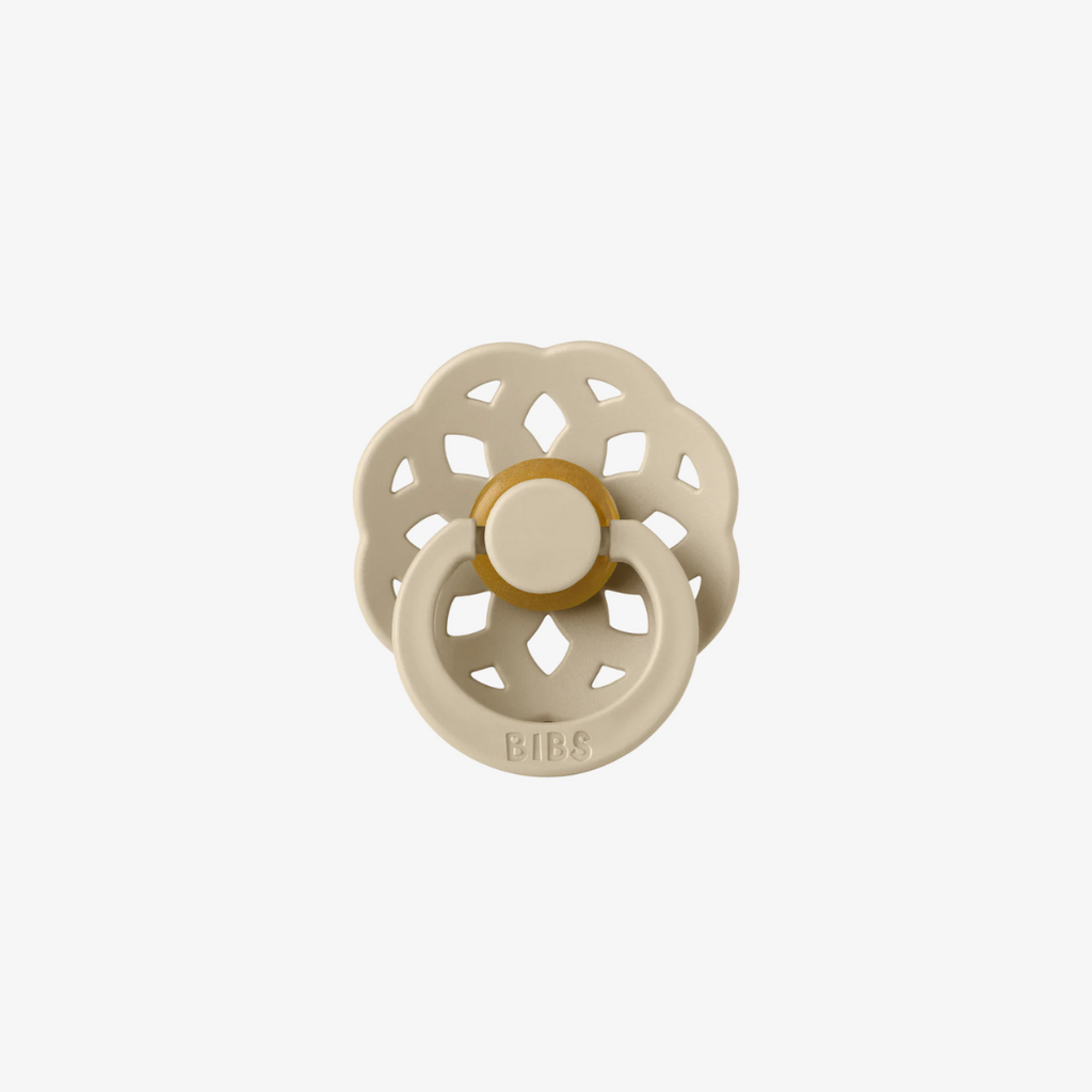 Beige and gold baby teether on a white background