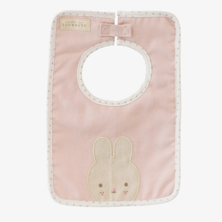 Pink baby bib with bunny design on a white background