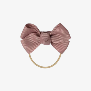 Pink hair bow on a white background