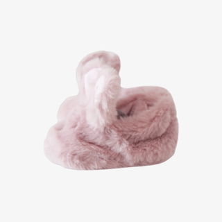 Pink fluffy slippers on a white background