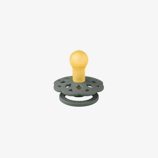 green pacifier with yellow bulb on a white background