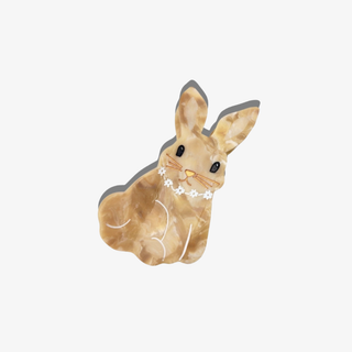 Marbled rabbit hair clip with a white background