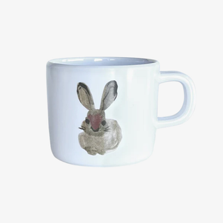 White mug with a rabbit design on a white background