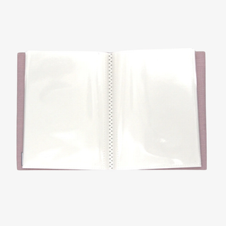 Open blank photo album with pink binding on a white background
